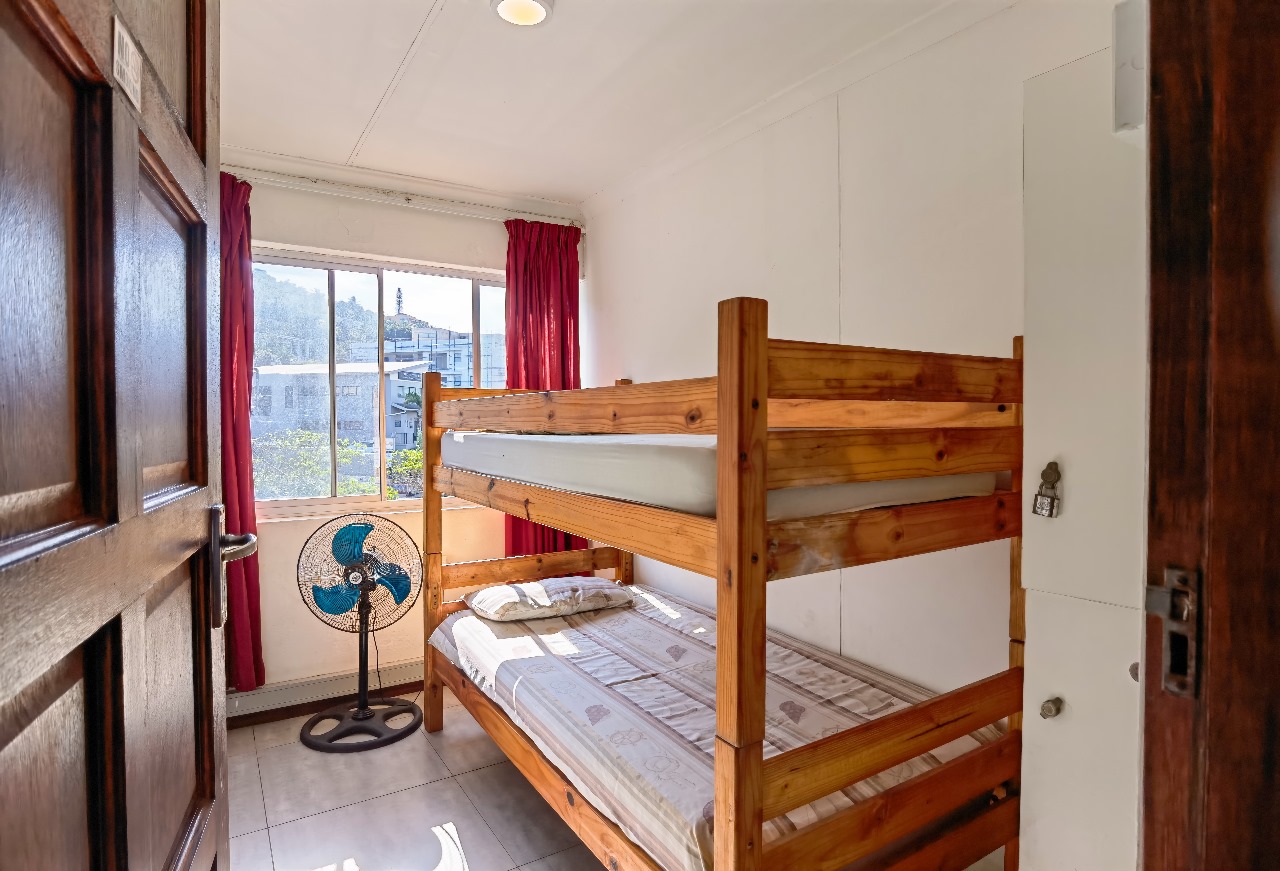 Close-up of wooden bunk beds in Ballito Backpackers' dorm room