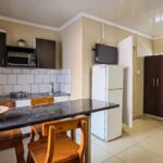 View from kitchenette into the dormitory sleeping area in Ballito Backpackers' semi self-catering 6-sleeper room